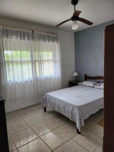 Säng eller sängar i ett rum på Casa Andar Térreo - Balneário Nordeste - Imbé - RS