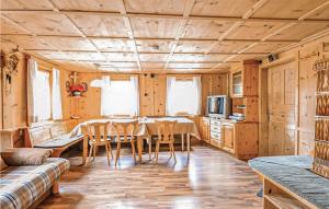 a kitchen and dining room with a table and chairs at Cozy Home In Mathon With House A Panoramic View in Mathon