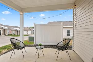 two chairs and a table on a patio at Modern 2BR 2BA New Build Condo with Garage & Patio in Wyoming