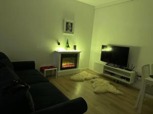 Telewizja i/lub zestaw kina domowego w obiekcie Apartament IGA