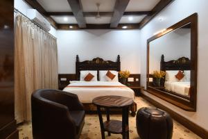 Hotel Lok Sagar Mysore客房内的一张或多张床位