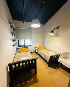 a room with two beds and a window at Casa en Bariloche Familiar - R2046 in San Carlos de Bariloche