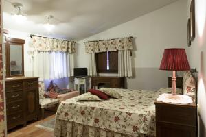 Кровать или кровати в номере Bosco D'Olmi Country House