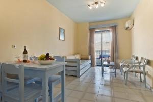 Posezení v ubytování Regina Studios & Hotel