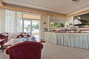 Posezení v ubytování Regina Studios & Hotel