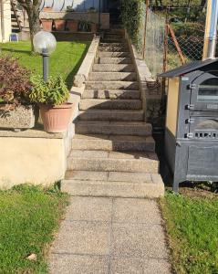 a set of stone steps in front of a house at ALBACHIARA in Ramazzano