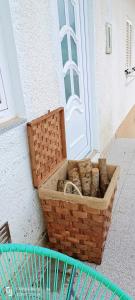 a basket of bread sitting in front of a door at Casa Sardinha 