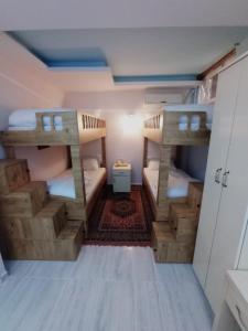 a small room with two bunk beds in it at Sultan Terrace Hostel in Istanbul