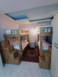 a small room with two bunk beds in it at Sultan Terrace Hostel in Istanbul