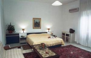 Ένα ή περισσότερα κρεβάτια σε δωμάτιο στο Park Hotel Gianfranco