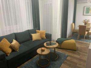 A seating area at VESTA Apartman