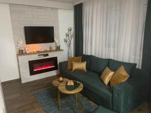 A seating area at VESTA Apartman