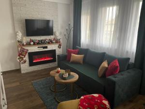 A seating area at VESTA Apartman