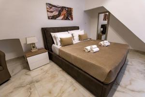 - une chambre avec un lit et 2 serviettes dans l'établissement Casa Cecilia, à Casamassima