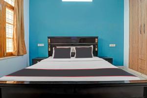 Cama ou camas em um quarto em OYO Flagship 81227 North Star Homestay