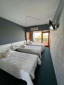 Cama ou camas em um quarto em Hotel Peninsula