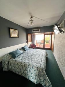 Cama ou camas em um quarto em Hotel Peninsula