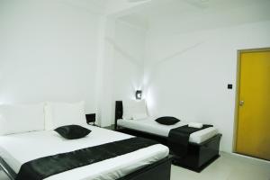 Postel nebo postele na pokoji v ubytování Villa Hotel + 37 fotografií