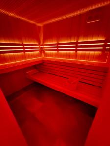 a red room with red lights on a shelf at Wellness Penzion HORSE FARM in Bravantice