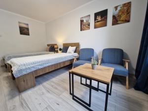 Postel nebo postele na pokoji v ubytování Apartament w Śródmieściu