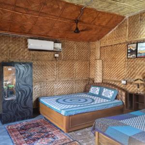 a bedroom with a bed in a room at Alohi The terrace Homestay in Tezpur