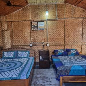 a bedroom with two beds in a room at Alohi The terrace Homestay in Tezpur