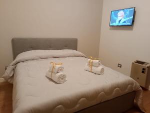 Ένα ή περισσότερα κρεβάτια σε δωμάτιο στο Rooms&Suite