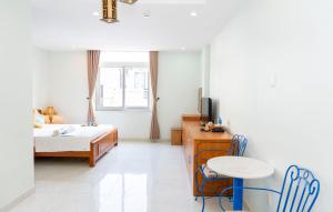 Postel nebo postele na pokoji v ubytování TNH Hotel Vung Tau