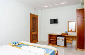 TV a/nebo společenská místnost v ubytování TNH Hotel Vung Tau