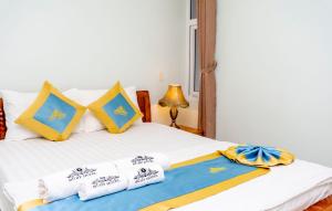 Postel nebo postele na pokoji v ubytování TNH Hotel Vung Tau