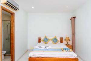 Postel nebo postele na pokoji v ubytování TNH Hotel Vung Tau
