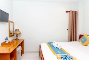 Postel nebo postele na pokoji v ubytování TNH Hotel Vung Tau