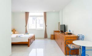TV a/nebo společenská místnost v ubytování TNH Hotel Vung Tau