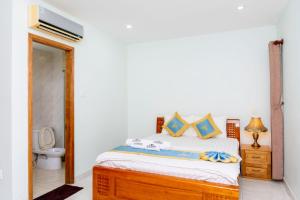 Postel nebo postele na pokoji v ubytování TNH Hotel Vung Tau