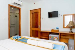 Postel nebo postele na pokoji v ubytování TNH Hotel Vung Tau
