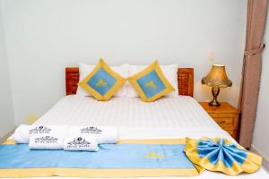Postel nebo postele na pokoji v ubytování TNH Hotel Vung Tau