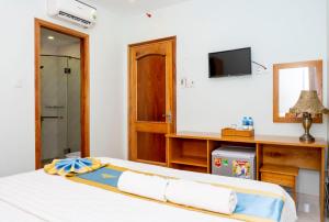 Postel nebo postele na pokoji v ubytování TNH Hotel Vung Tau