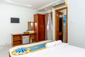 Postel nebo postele na pokoji v ubytování TNH Hotel Vung Tau