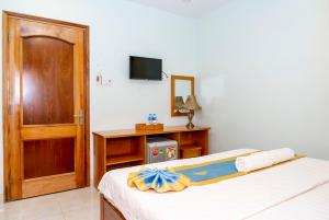 Postel nebo postele na pokoji v ubytování TNH Hotel Vung Tau