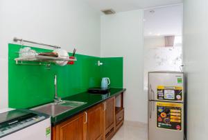 Kuchyň nebo kuchyňský kout v ubytování TNH Hotel Vung Tau