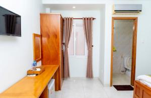 TV a/nebo společenská místnost v ubytování TNH Hotel Vung Tau