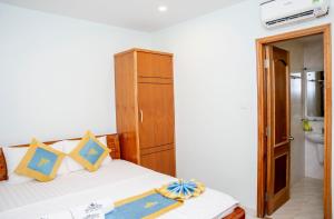 Postel nebo postele na pokoji v ubytování TNH Hotel Vung Tau