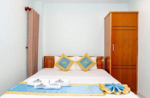Postel nebo postele na pokoji v ubytování TNH Hotel Vung Tau