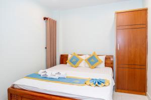 Postel nebo postele na pokoji v ubytování TNH Hotel Vung Tau