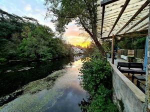 a view of a river next to a building at PETIT PARADIS in La Bruffière
