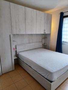 Llit o llits en una habitació de Residence Itaca Porto Pozzo