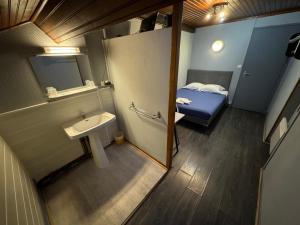 Letto o letti in una camera di Le Terminus d'Albi