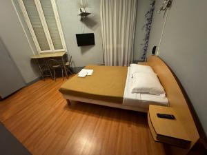 Letto o letti in una camera di Le Terminus d'Albi