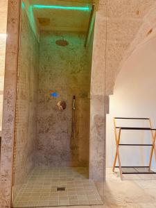 a shower with a glass door in a bathroom at Al Palazzotto in Fasano