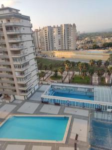 an overhead view of two swimming pools on a building at Apartamento de lujo mar y montaña para todo el año con calefacción spa gimnasio y piscina climatizada in Tavernes de Valldigna